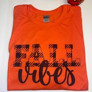 Orange polyester t-shirt with Fall Vibes graphic